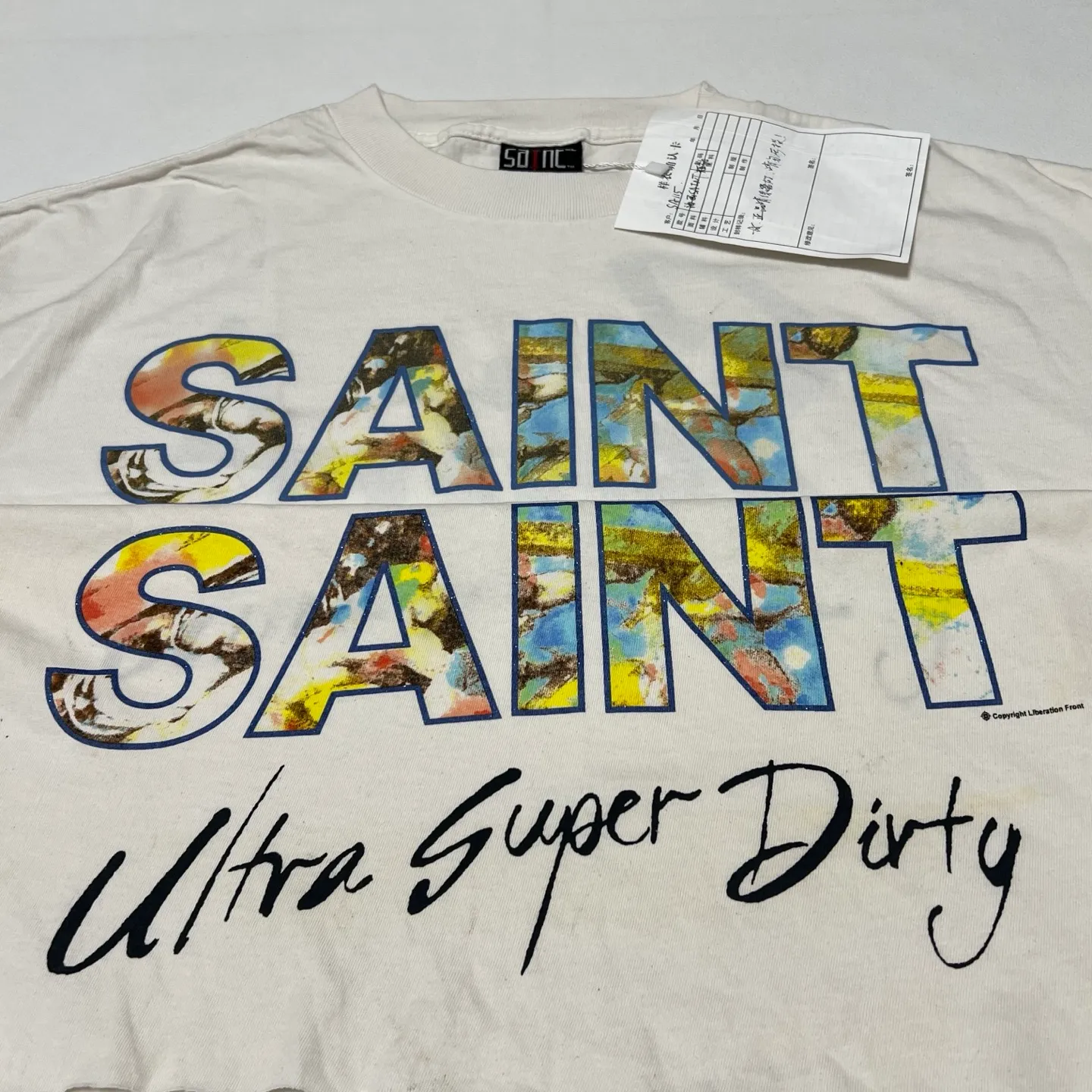 SAINT Mxxxxxx SS TEE/SUPER DIRTY/WHT oil painting SAINT SUPER DIRTY slogan TEE off-white S-XL Made of original OE yarn tube weaving without side seams to distinguish the split fabrics original consistent VINTAGE label/little angel anti-counterfeiting label top printing technology highly restored original details